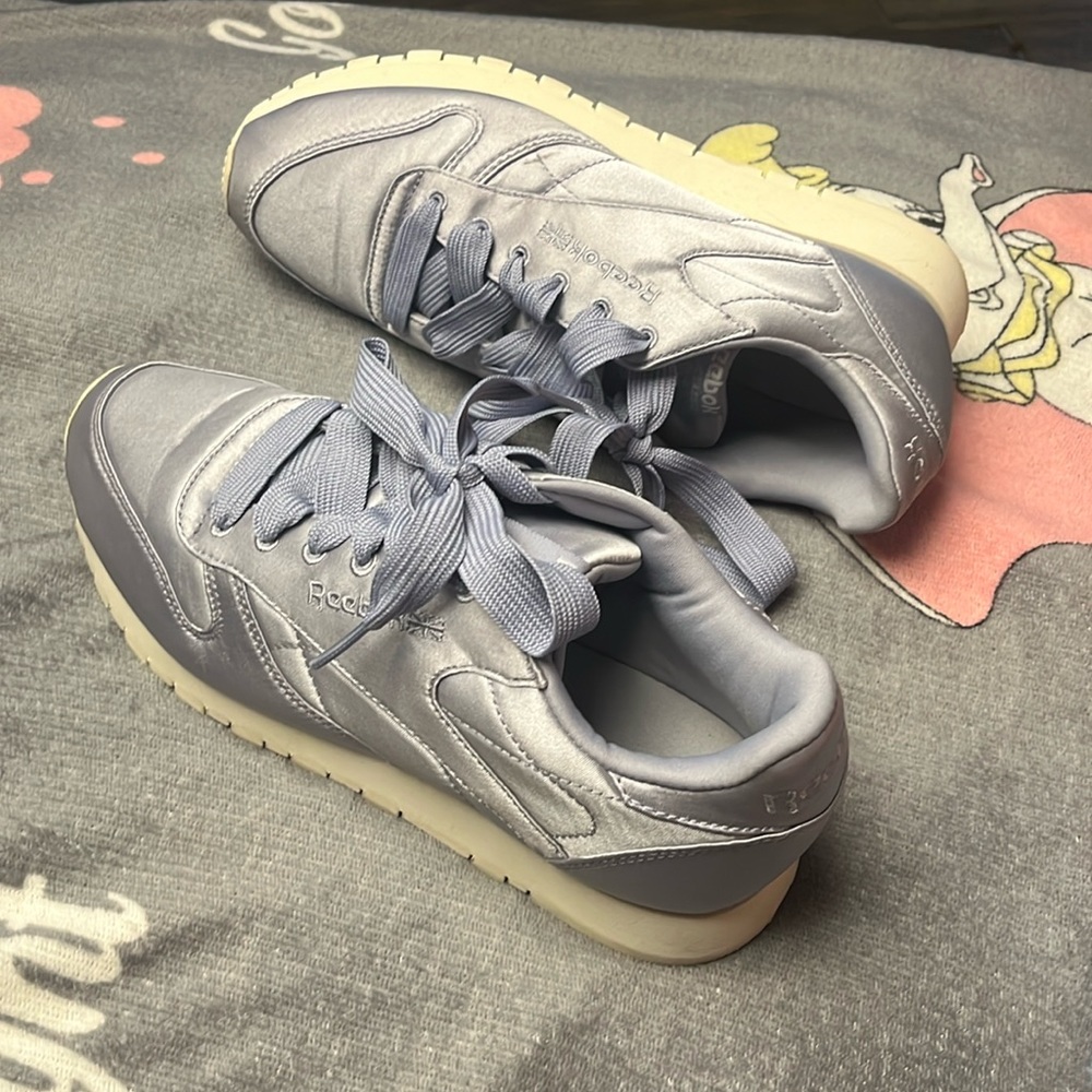 Lilac satin Reebok tennis shoes. Used once. Very minimal wear and no stains.
